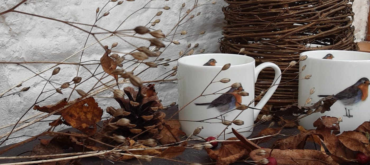 Robin mugs in leaves and dried flowers