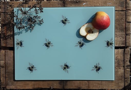 Bee glass chopping board with sliced fruit