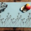 Poppy glass chopping board with sliced fruit