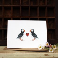 A6 card featuring Puffins with heart and flowers