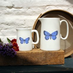 Two sized jugs featuring the Holly Blue design with flowers
