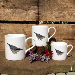 3 mugs featuring the Nuthatch design with flowers