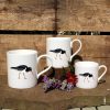 3 mugs featuring the Oystercatcher design with flowers