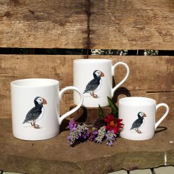 3 mugs featuring the Puffin design with flowers