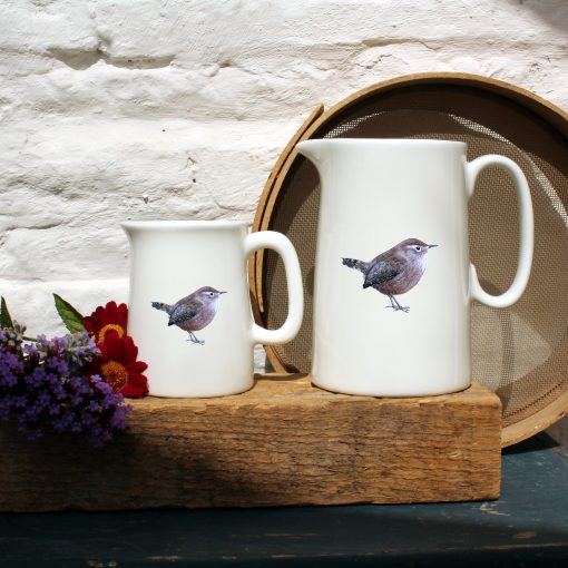 Two sized jugs featuring the Wren design with flowers