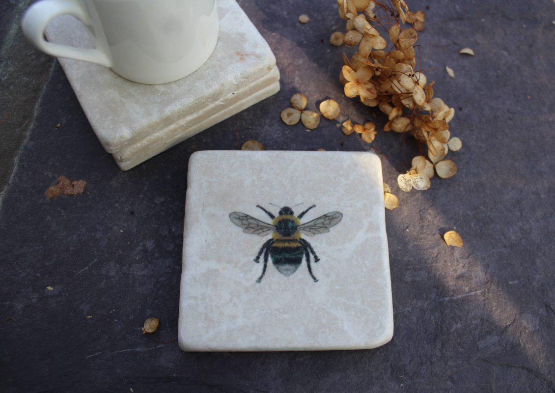 Marble coaster featuring Claire Vaughan's Bee design