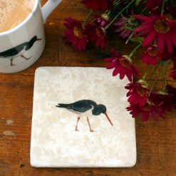 Marble Oystercatcher coaster with mug and flowers
