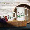 Two sized jugs featuring the Wild Strawberry design with flowers