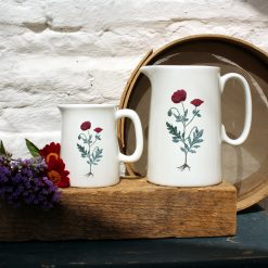 Two sized jugs featuring the Red Poppy design with flowers