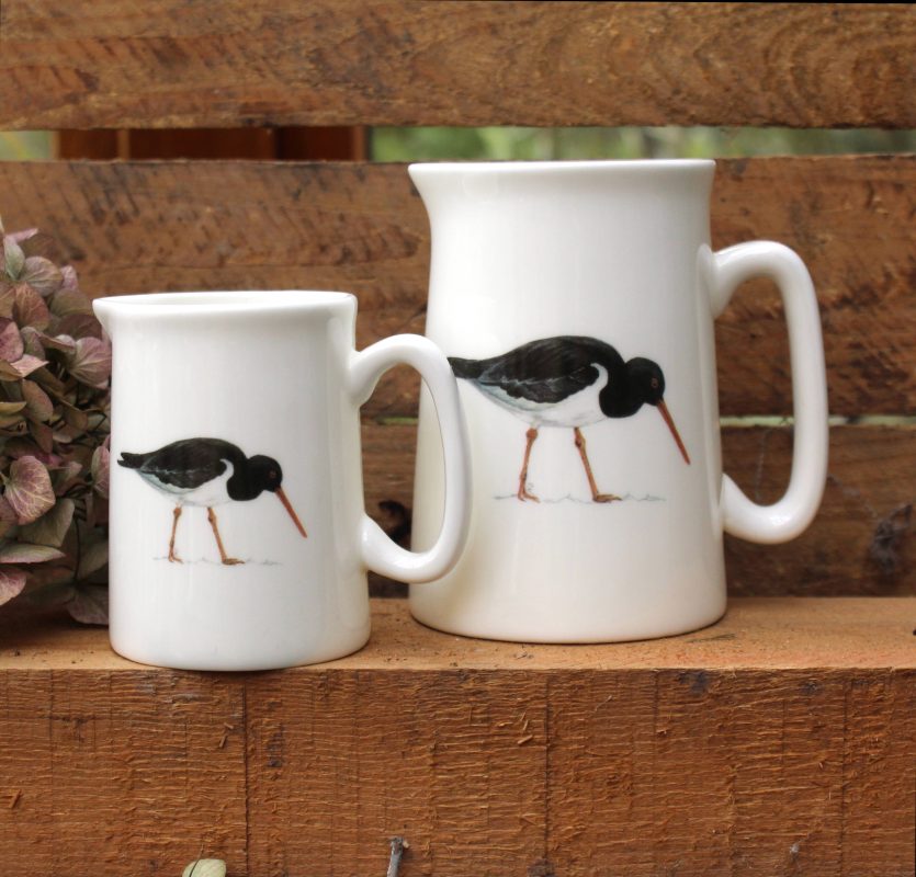 Large and small Oystercatcher jugs with flower