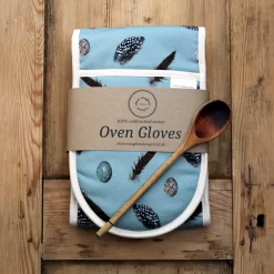 Feather and egg oven gloves with wooden spoon