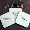 Three Nuthatch coasters with flower