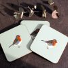 Three Robin coasters with flower