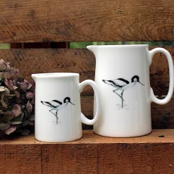 Two Avocet jugs with flower