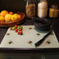 Bee glass chopping board on worktop