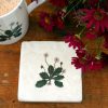 Marble Daisy coaster with mug and flowers