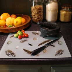 Feather and Egg glass chopping board on worktop
