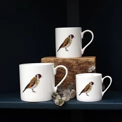 Three Goldfinch mugs with leaves on shelf