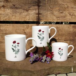3 mugs featuring the Red Poppy design with flowers