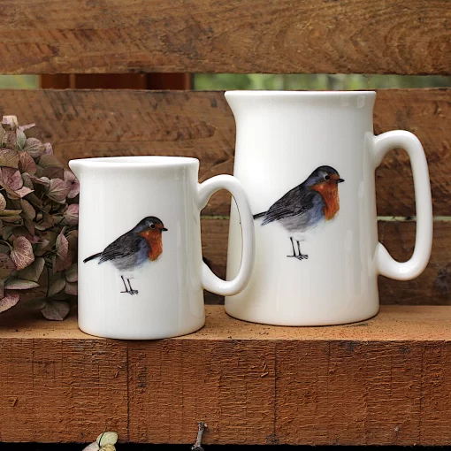 Two Robin jugs with flower