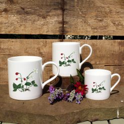 3 mugs featuring the Wild Strawberry design with flowers