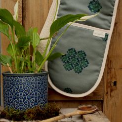 Succulent oven gloves with pot plant and wooden spoon