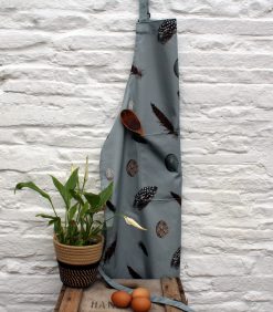 Feather & Egg apron with plant and eggs