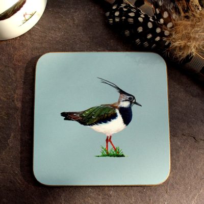 Lapwing coaster with feathers and mug