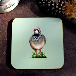 Partridge coaster with feathers and mug