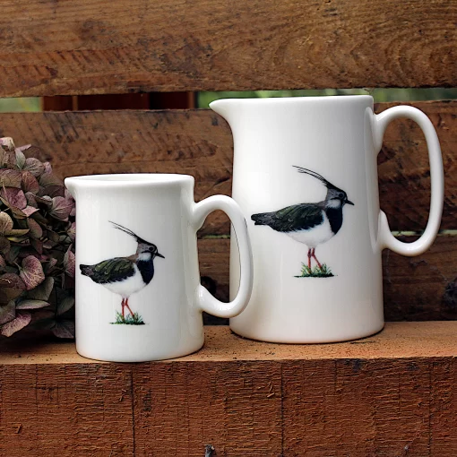 Two Lapwing jugs with flower