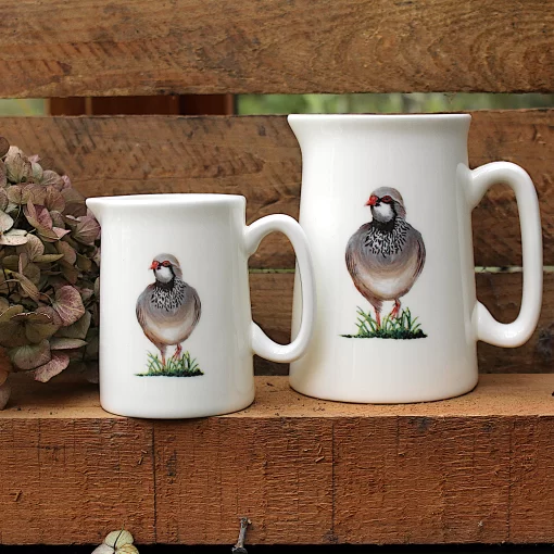 Two Partridge jugs with flower