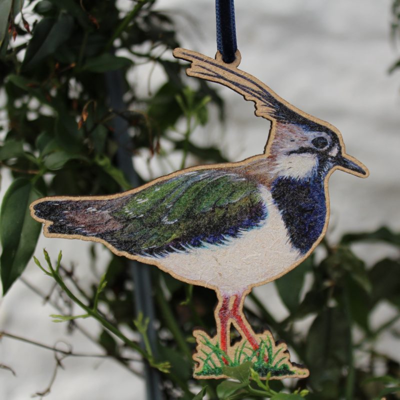 Lapwing wooden decoration with velvet ribbon hanging on tree